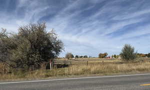 View of asphalt road with a view of countryside