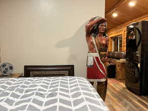Bedroom featuring wood finished floors, recessed lighting, and wooden ceiling