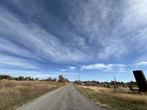 View of asphalt street featuring a rural view