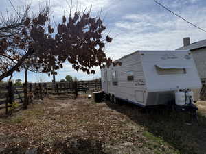 View of side of home with a cooling unit