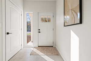 Foyer entrance featuring concrete floors