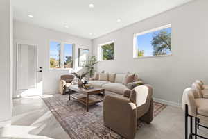 Living room with recessed lighting and baseboards