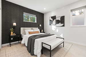 Bedroom with recessed lighting, wallpapered walls, and an accent wall