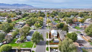 Aerial perspective of suburban area with a mountainous background