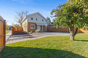 View of front facade featuring board and batten siding, a standing seam roof, a metal roof, and a porch