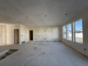 Open concept living room featuring healthy amount of natural light and a 9' ceiling