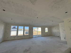 Open concept living room featuring healthy amount of natural light and a 9' ceiling