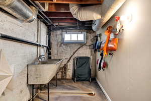 Basement featuring a sink