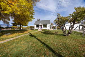 Bungalow with a chimney and a detached garage