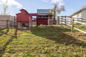 View of yard featuring exterior structure and an outbuilding