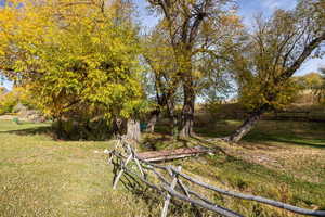 View of yard with a rural view