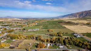 View of property location featuring rural landscape, farmland, and a mountainous background