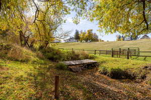 View of yard with a rural view