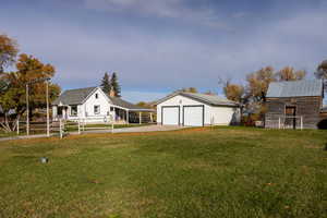 View of yard featuring an outbuilding and a detached garage