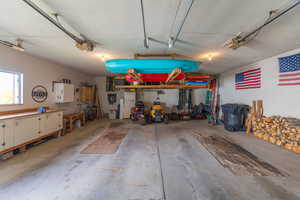 Garage featuring freestanding refrigerator
