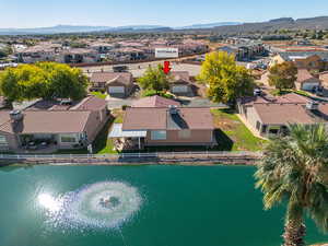 Aerial perspective of suburban area featuring a water and mountain view