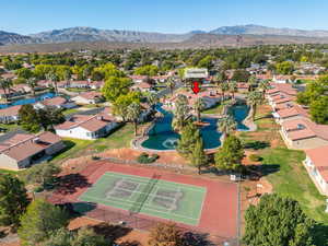 Aerial perspective of suburban area with a water and mountain view