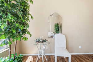 Detailed view of wood finished floors and baseboards