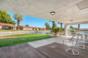 Fenced backyard with a residential view and a patio area