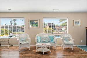 Living area featuring wood finished floors and baseboards