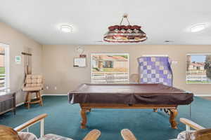 Recreation room with plenty of natural light and billiards