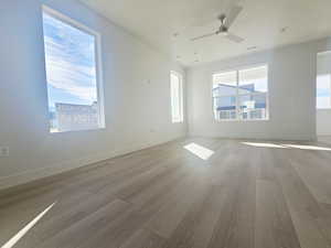 Unfurnished room with light wood-style floors, recessed lighting, and a ceiling fan