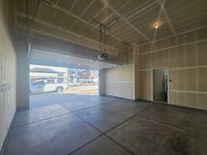 Garage featuring a garage door opener