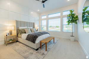 Bedroom featuring a decorative wall, carpet flooring, a ceiling fan, and recessed lighting