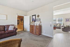 Living room with carpet and wood finished floors