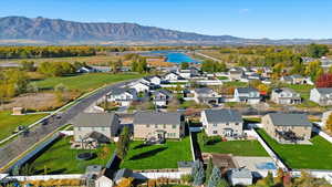 Aerial perspective of suburban area with a water and mountain view
