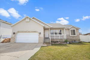 Ranch-style house with driveway, covered porch, an attached garage, and stucco siding
