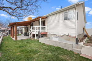 Back of property featuring a patio and a chimney