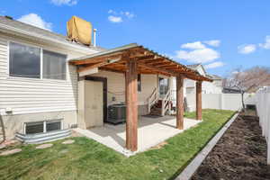 Back of property featuring a patio and a fenced backyard