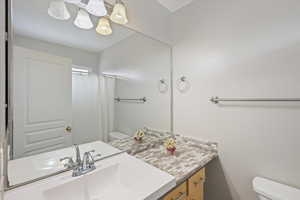 Full bath featuring a shower with curtain and vanity