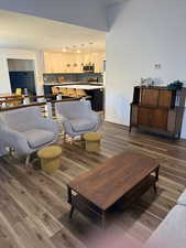 Living area featuring dark wood finished floors and a textured ceiling