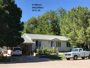 Ranch-style home with an attached garage and concrete driveway