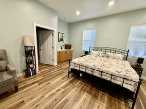 Bedroom featuring light wood finished floors and recessed lighting