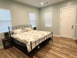 Bedroom featuring light wood-style floors and recessed lighting
