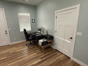 Office area featuring dark wood finished floors