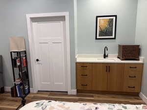 Bathroom featuring vanity and dark wood finished floors