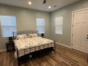 Bedroom featuring recessed lighting, dark wood-style flooring, and ceiling fan