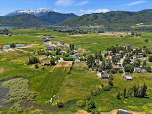 Aerial view of property's location featuring a water and mountain view