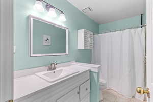 Bathroom with vanity and light tile patterned floors