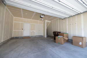 Garage featuring a garage door opener