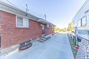 View of property exterior featuring brick siding