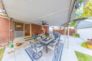 View of patio / terrace with outdoor dining space, area for grilling, and a ceiling fan
