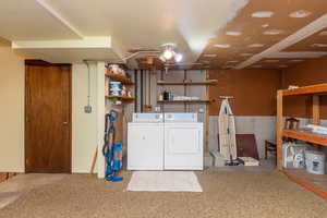 Finished below grade area with washer and clothes dryer