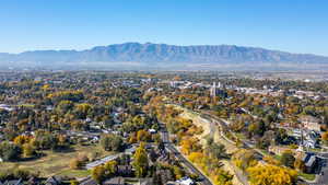 Aerial perspective of suburban area with a mountain backdrop