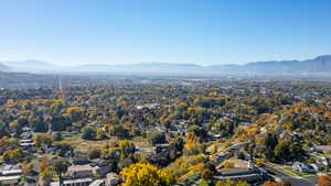 Aerial perspective of suburban area featuring a mountainous background