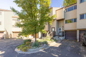 View of front of property featuring driveway and a garage
